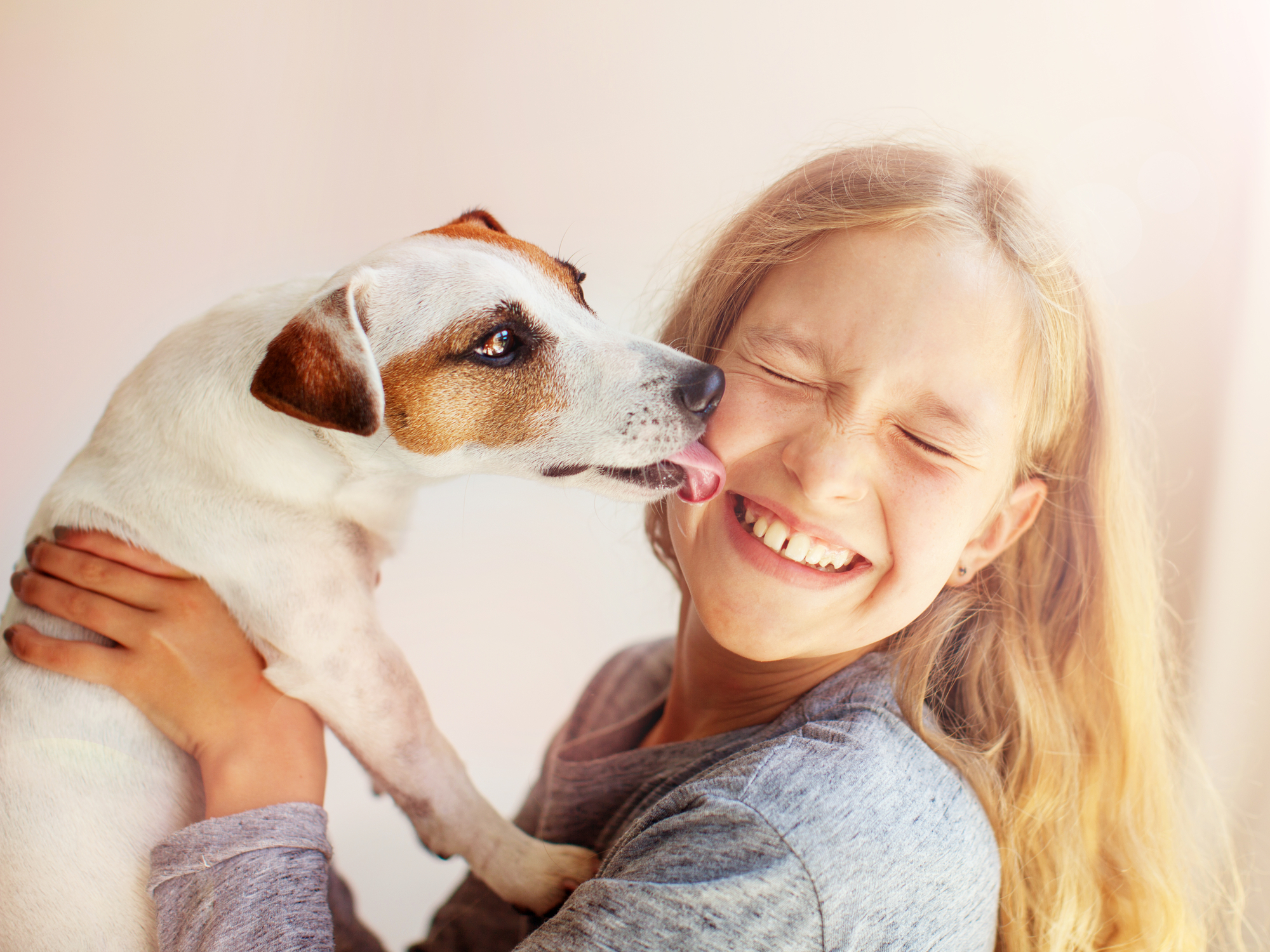 A happy child with her dog.